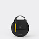 Маленькая черная круглая сумочка из сафьяновой кожи с дополнительным наплечным ремешком  Cromia