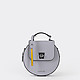 Маленькая круглая сумочка из сафьяновой кожи в пастельно-фиолетовом оттенке с дополнительным наплечным ремешком  Cromia