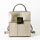 Прямоугольный золотистый рюкзак-сумка Bell из матовой и глянцевой кожи со съемными лямками  Cromia