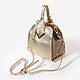 Трапециевидная золотистая сумочка небольшого размера из натуральной кожи и замши  Carlo Salvatelli