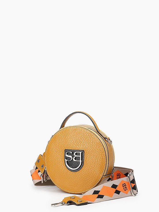 Круглая сумка-боулер из горчично-желтой и черной кожи с ярким текстильным ремешком  Sara Burglar