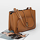 Кожаная коричневая сумка с деталью на карабине  DKNY